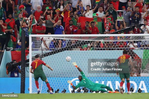Cristiano Ronaldo of Portugal coverts the penalty to score their team's first goal past Lawrence Ati Zigi of Ghana during the FIFA World Cup Qatar...
