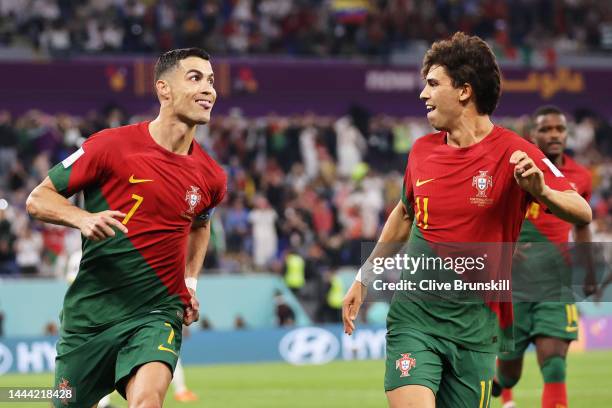 Cristiano Ronaldo of Portugal celebrates with Joao Felix after scoring their team's first goal via a penalty during the FIFA World Cup Qatar 2022...