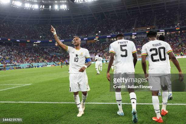 Andre Ayew of Ghana celebrates after scoring their team's first goal during the FIFA World Cup Qatar 2022 Group H match between Portugal and Ghana at...