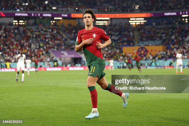 Joao Felix of Portugal celebrates after scoring their team's second goal past Lawrence Ati Zigi of Ghana during the FIFA World Cup Qatar 2022 Group H...