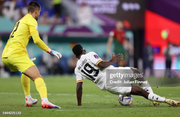 Diogo Costa of Portugal makes a save against Inaki Williams of Ghana during the FIFA World Cup Qatar 2022 Group H match between Portugal and Ghana at...