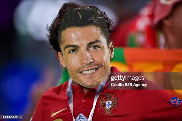 Fan of Portugal is seen with a mask of Cristiano Ronaldo of Portugal prior to the Group H - FIFA World Cup Qatar 2022 match between Portugal and...