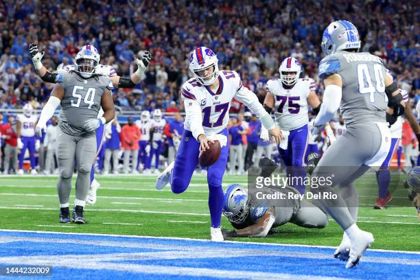 Josh Allen of the Buffalo Bills rushes for a touchdown against the Detroit Lions during the second quarter at Ford Field on November 24, 2022 in...