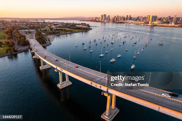 coronado bridge in san diego during golden hour - san diego bay stock pictures, royalty-free photos & images