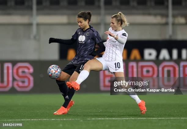 Viktoria Pinther of FC Zürich Frauen challenges Dzsenifer Marozsán of Olympique Lyonnais during the UEFA Women's Champions League group C match...