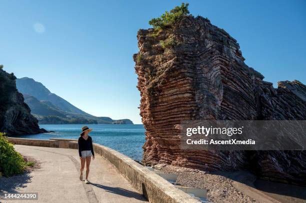 walking along the waterfront of budva, montenegro. - budva stock pictures, royalty-free photos & images