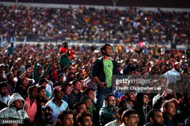 Doha workers and Football fans watch the match between Portugal and Ghana at the Industrial Area Fan Zone in the Asian Town Cricket Stadium on...