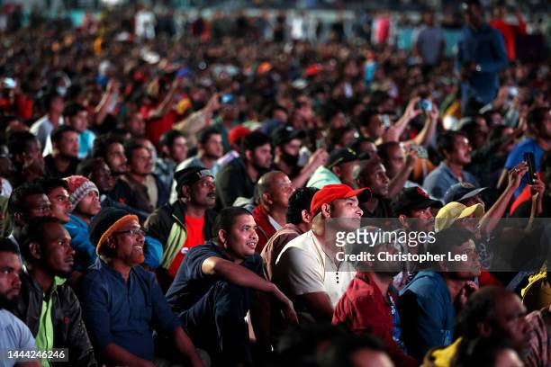 Doha workers and Football fans watch the match between Portugal and Ghana at the Industrial Area Fan Zone in the Asian Town Cricket Stadium on...