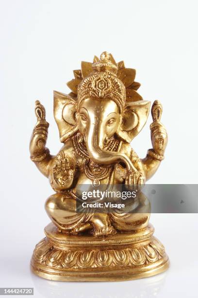 an idol of ganesh - gold statue stock pictures, royalty-free photos & images