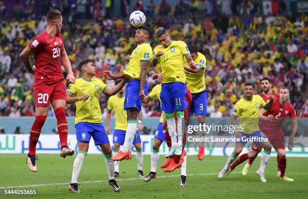 Alex Sandro of Brazil heads to clear the ball during the FIFA World Cup Qatar 2022 Group G match between Brazil and Serbia at Lusail Stadium on...