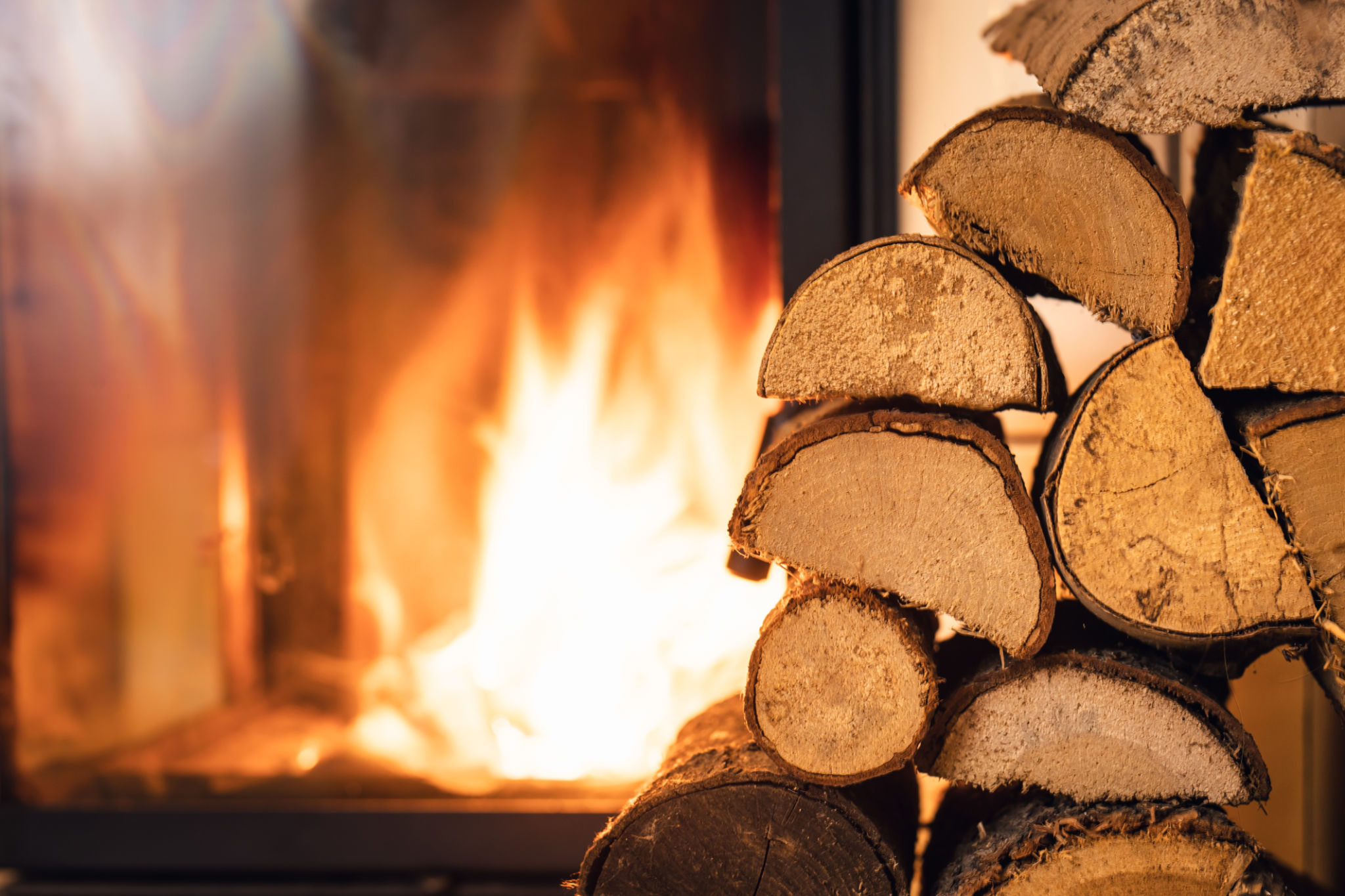 Firewood stack in front of stove. Firewood stack in front of stove.