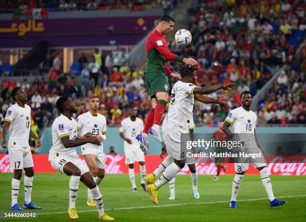 Cristiano Ronaldo of Portugal competes for a header against Mohammed Salisu of Ghana during the FIFA World Cup Qatar 2022 Group H match between...