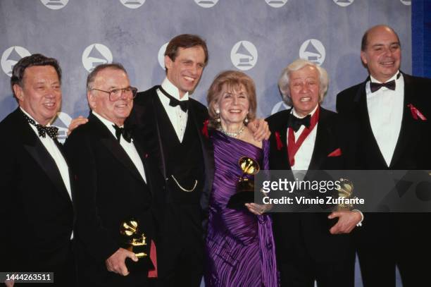 Sy Coleman, Pierce Cosette, Keith Carradine, Betty Comden and Adolph Green in the press room of the 34th Grammy Awards, held at Radio City Music Hall...