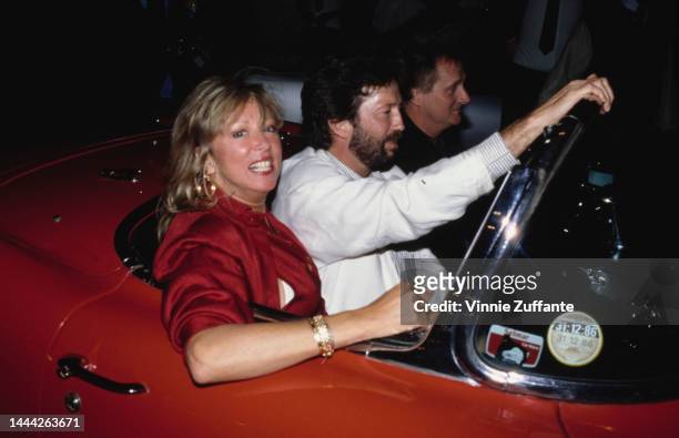 Eric Clapton and his wife - model Pattie Boyd, in a car, circa 1987s.