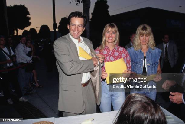 Robert Carradine, wife Edie Mani and an unidentified woman attend the grand opening party for Grand Havana Room at Canon Restaurant in Beverly Hills,...