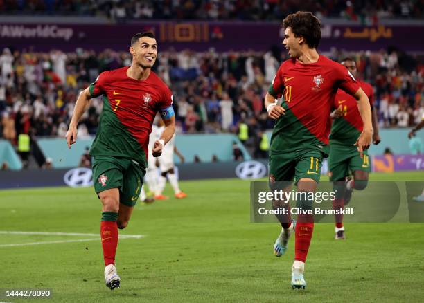 Cristiano Ronaldo of Portugal celebrates with Joao Felix after scoring their team's first goal via a penalty during the FIFA World Cup Qatar 2022...