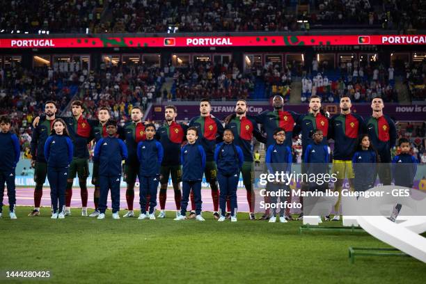 Team of Portugal sings the national anthem prior to the FIFA World Cup Qatar 2022 Group H match between Portugal and Ghana at Stadium 974 on November...