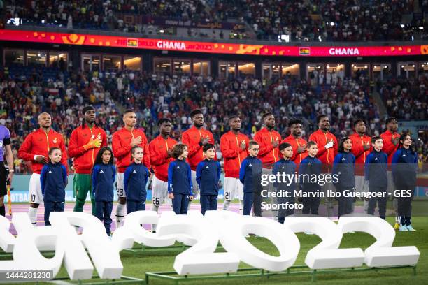 Team of Ghana sings the national anthem prior to the FIFA World Cup Qatar 2022 Group H match between Portugal and Ghana at Stadium 974 on November...