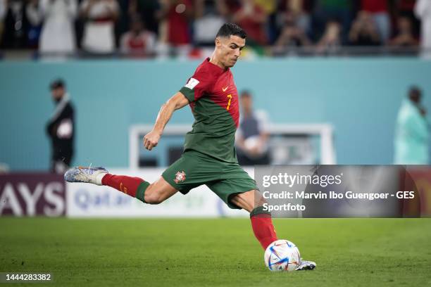 Cristiano Ronaldo of Portugal scores his team's first goal during the FIFA World Cup Qatar 2022 Group H match between Portugal and Ghana at Stadium...