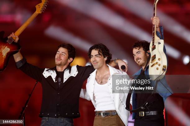 The Jonas Brothers perform during half time in the game between the New York Giants and the Dallas Cowboys at AT&T Stadium on November 24, 2022 in...