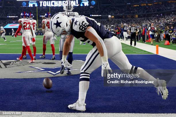 Dalton Schultz of the Dallas Cowboys celebrates a touchdown during the second half in the game against the New York Giants at AT&T Stadium on...