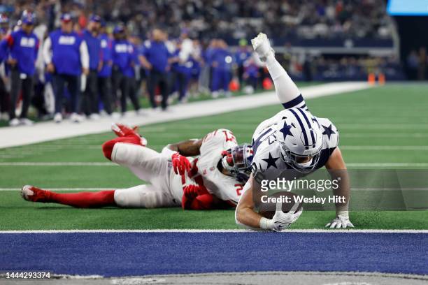 Dalton Schultz of the Dallas Cowboys scores a touchdown during the second half in the game against the New York Giants at AT&T Stadium on November...