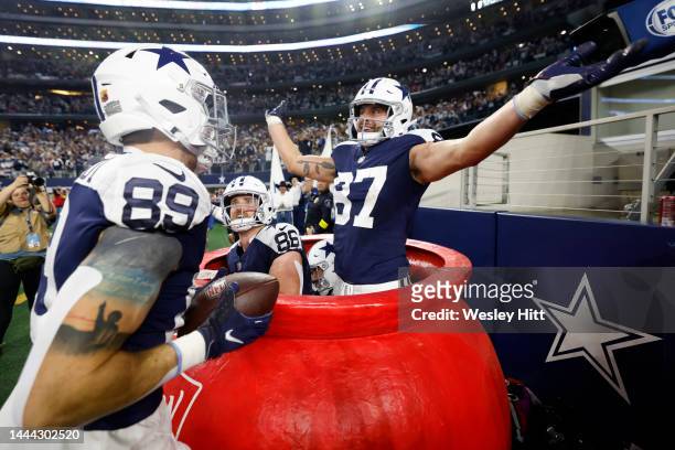 Peyton Hendershot of the Dallas Cowboys celebrates a touchdown with Jake Ferguson and Dalton Schultz during the second half in the game against the...