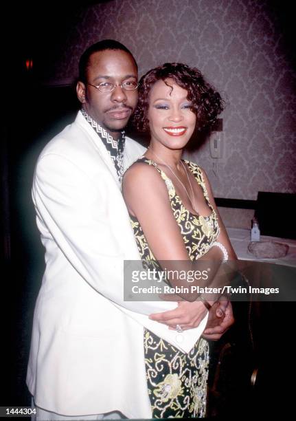 Whitney Houston with Bobby Brown at "Whitney Houston''s All-Star Holiday Gala" in New York, NY, December 4, 1999.