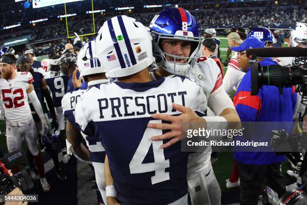Dak Prescott of the Dallas Cowboys and Daniel Jones of the New York Giants embrace after the game at AT&T Stadium on November 24, 2022 in Arlington,...