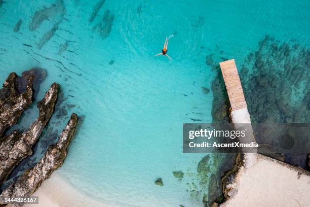 woman swimming in the adriatic sea - albânia imagens e fotografias de stock