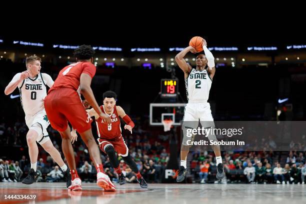 Tyson Walker of the Michigan State Spartans shoots the ball during the first half against the Alabama Crimson Tide at Moda Center on November 24,...