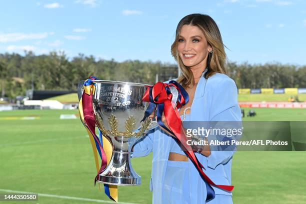 Delta Goodrem poses with the trophy during an AFLW Grand Final pre-match entertainment media opportunity at Brighton Homes Arena on November 25, 2022...