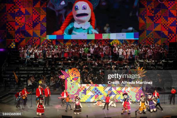 Children perform the "Mi muñeca me hablo" in the company of characters from the TV puppet show "31 Minutos" during "Tengo Un Sueño 2022" event at...