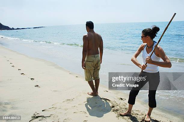 A Couple Playing At The Beach, Foto de stock