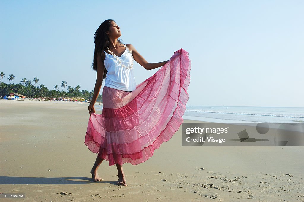 Portrait of a girl dancing on a beach