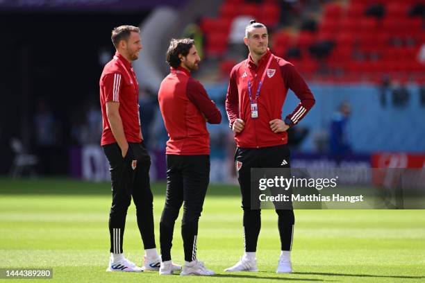 Chris Gunter, Joe Allen and Gareth Bale of Wales inspect the pitch prior to the FIFA World Cup Qatar 2022 Group B match between Wales and IR Iran at...