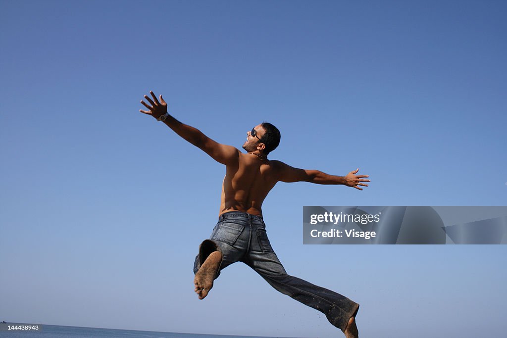 An enthusiastic man jumping