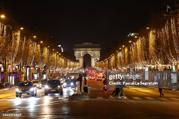 The Champs Elysees avenue is illuminated for the Christmas and New Year celebrations on November 24, 2022 in Paris, France. In order to help save...