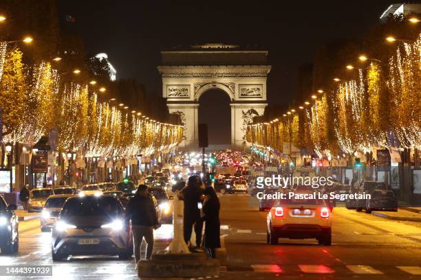 The Champs Elysees avenue is illuminated for the Christmas and New Year celebrations on November 24, 2022 in Paris, France. In order to help save...