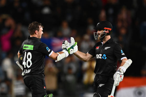 Tom Latham of the Black Caps celebrates after scoring a century with Kane Williamson of the Black Caps during game one of the One Day International...