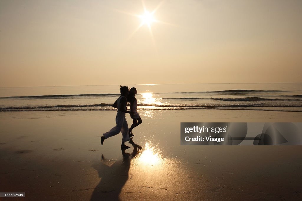 Couple walking on the beach