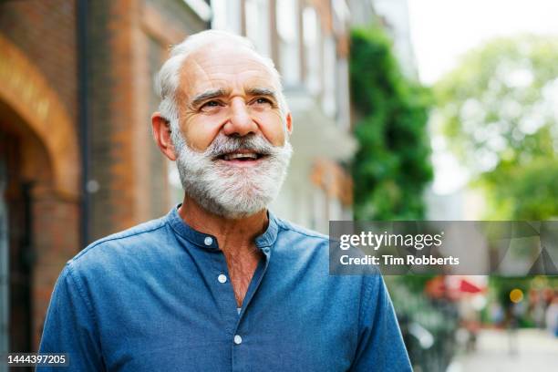 man looking up, smiling - cooler opa stock-fotos und bilder