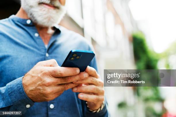 close up of man using smart phone - hand stock pictures, royalty-free photos & images