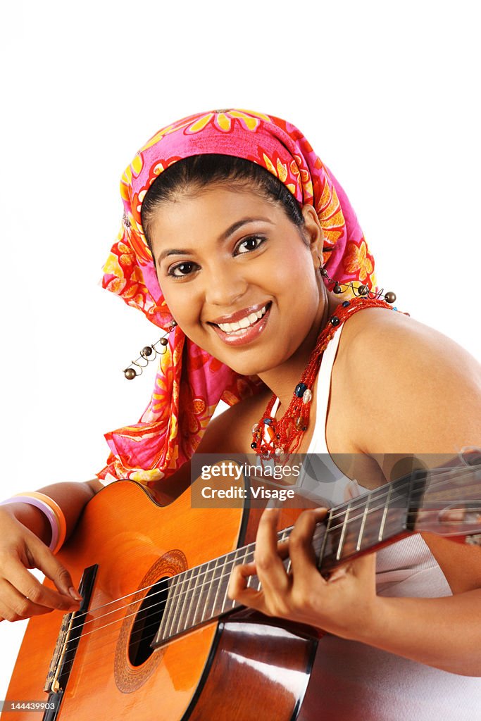 Portrait of a woman playing guitar