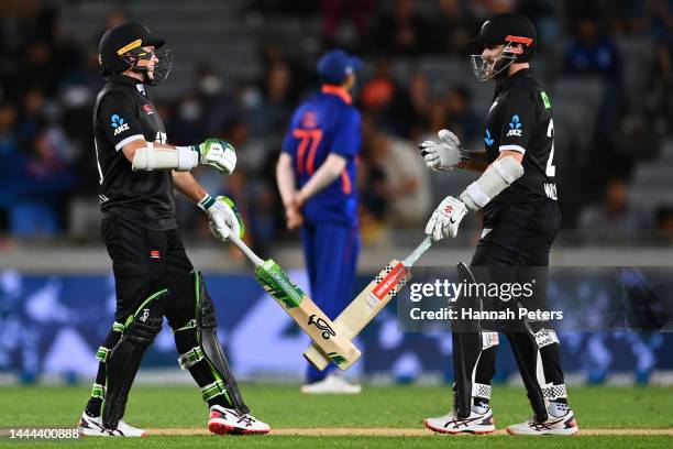 Kane Williamson and Tom Latham of the Black Caps celebrate after winning game one of the One Day International series between New Zealand and India...