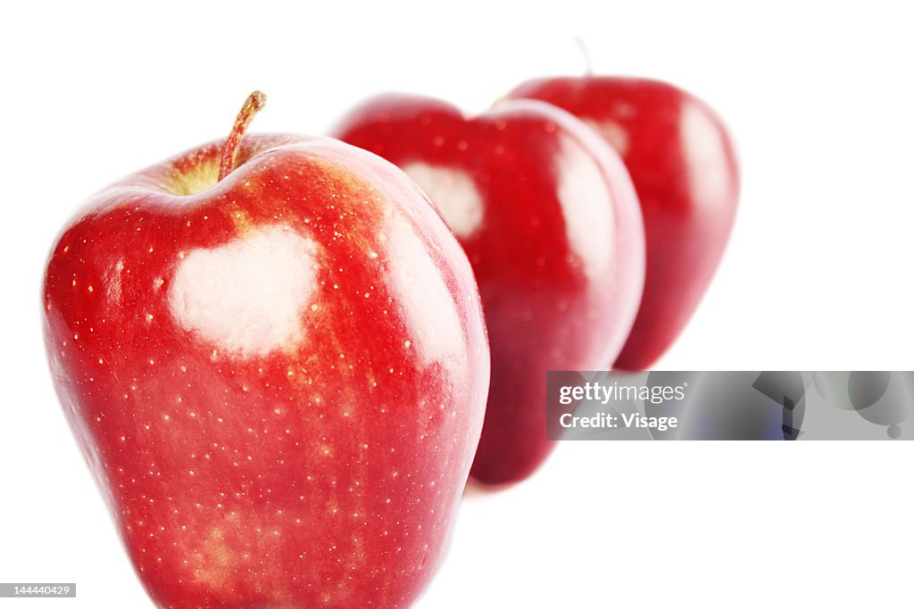 Apples arranged in a row