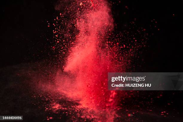 abstract red powder explosion red dust splattered - black powder stock pictures, royalty-free photos & images