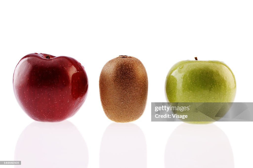 Single Two Apples Two Apples And A Single Kiwifruit In A Row High-Res Stock Photo - Getty ...