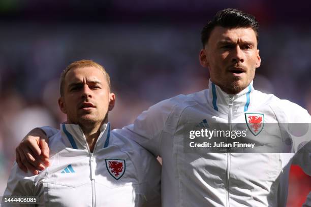 Aaron Ramsey and Kieffer Moore of Wales stand for the national anthem prior to the FIFA World Cup Qatar 2022 Group B match between Wales and IR Iran...