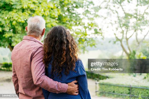 Hugging View From Behind Happy Wife Hugging Her Husband From Behind Photos and Premium High Res ...